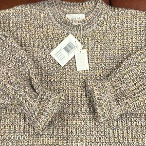 The Great multi colored sweater. This is an acrylic and wool blend.